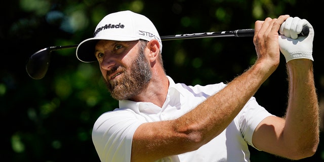 Dustin Johnson hits the seventh hole during a practice round for the US Open golf tournament at The Country Club, Wednesday, June 15, 2022, in Brooklyn, Massachusetts. 