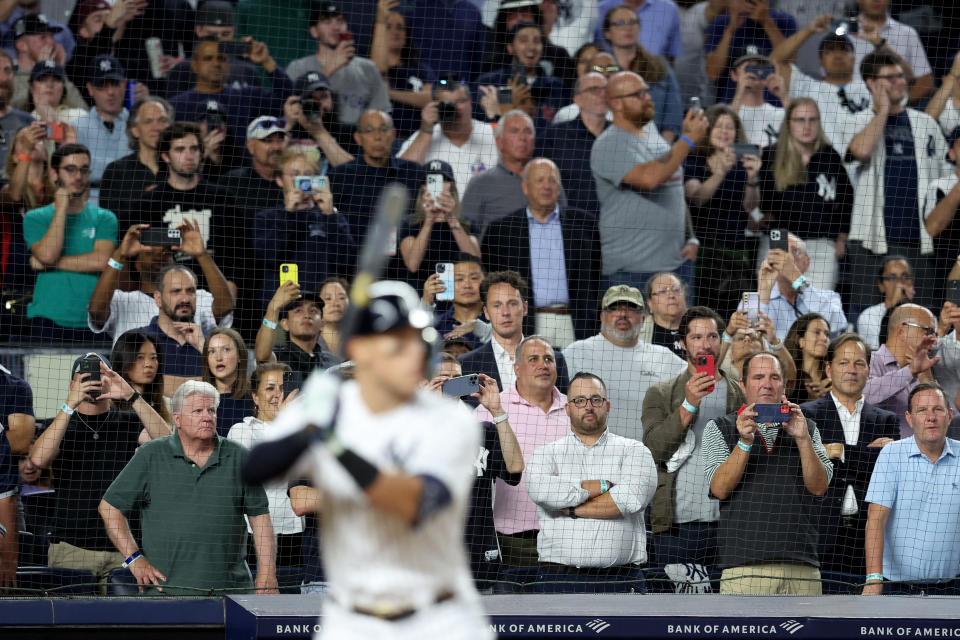 20 September 2022;  Bronx, New York, USA;  Fans watch New York Yankees right-back Aaron Judge (99) hit against the Pittsburgh Pirates during the sixth inning at Yankee Stadium.  Mandatory credit: Brad Penner-USA TODAY Sports