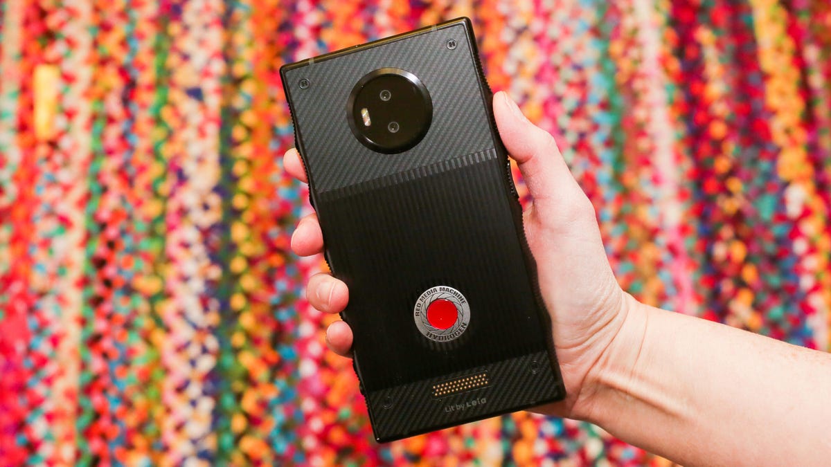 A Red Hydrogen One phone is someone's hand