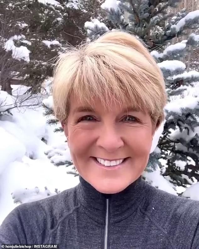 Julie Bishop takes her fitness to the next level as she works on her yoga skills in the snow