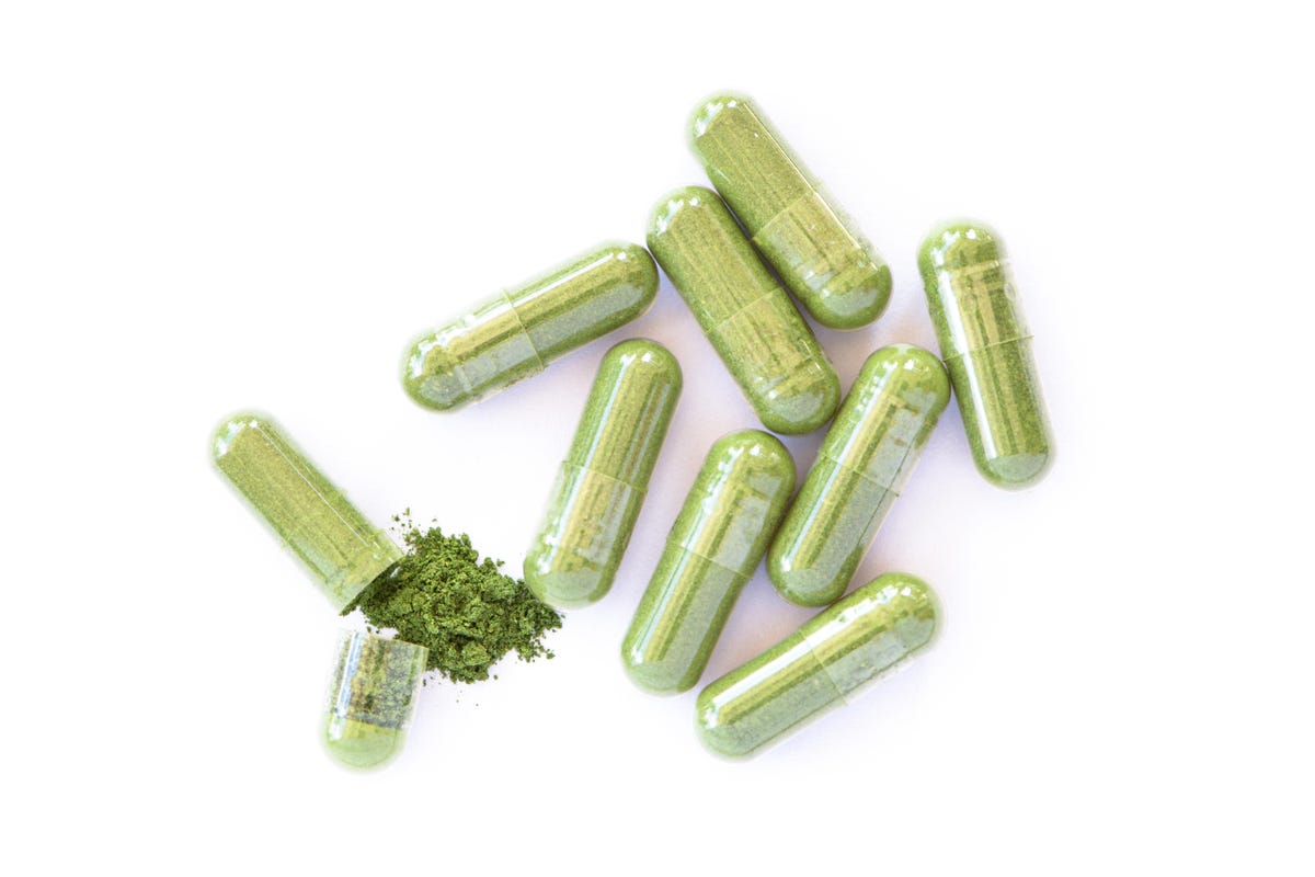 Transparent capsules containing green powder